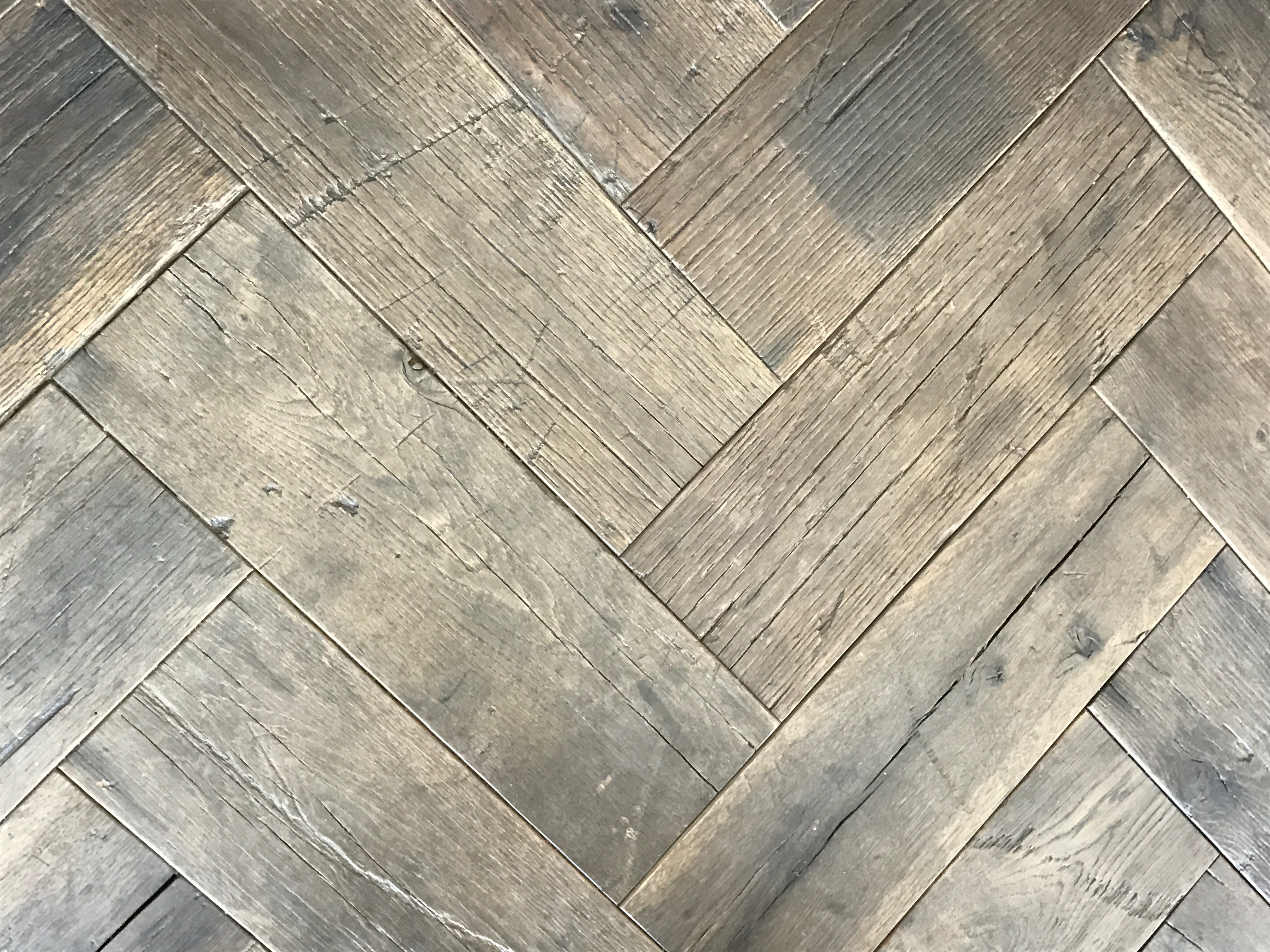 Herringbone floor made from cotton mill oak in a residence in Pemaquid, Maine, sourced by Rousseau Reclaimed Lumber & Flooring