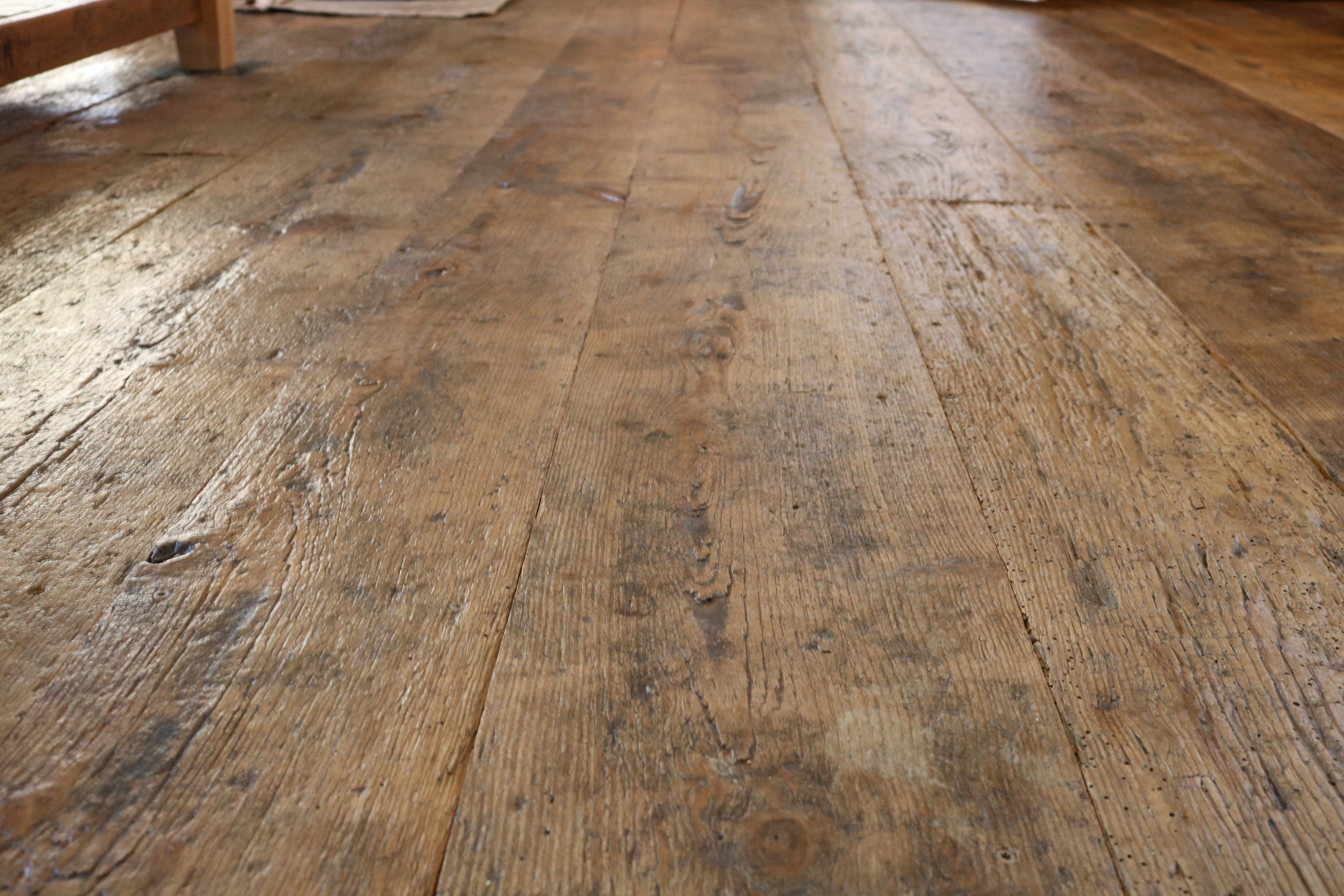 Wide plank flooring made from barn board in a residence in Yarmouth, Maine, sourced by Rousseau Reclaimed Lumber & Flooring