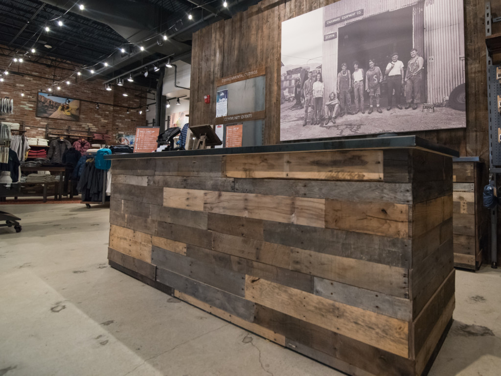 Outerwear retail store Denali in Providence, Rhode Island, featuring a cash wrap with lumber sourced by Rousseau Reclaimed Lumber & Flooring